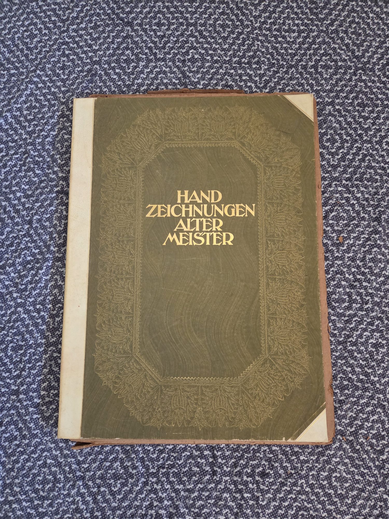 The green cloth portfolio cover of this copy